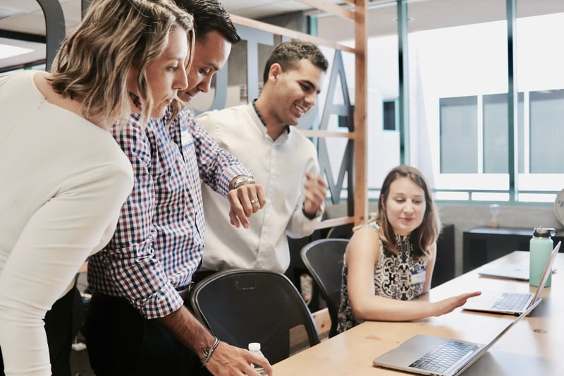 Engaged team looking at computer screen together