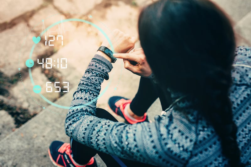 Female runner using smart watch