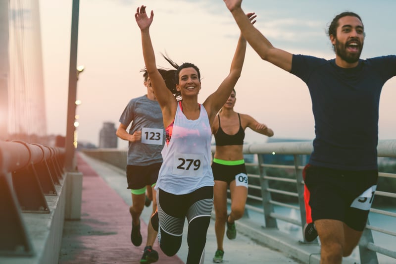 group of runners crossing the finish line