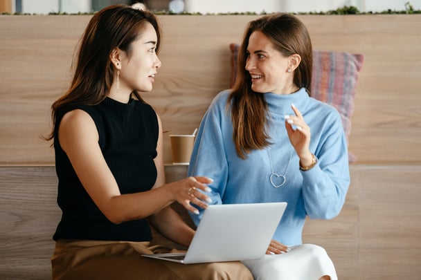 Two professional women with a laptop