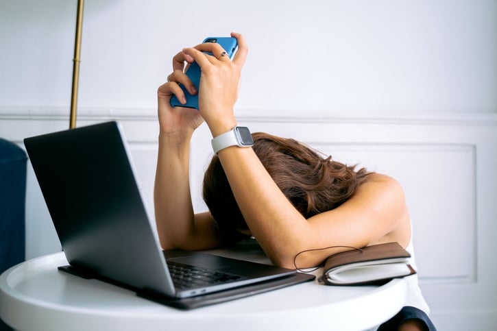 Tired woman with laptop