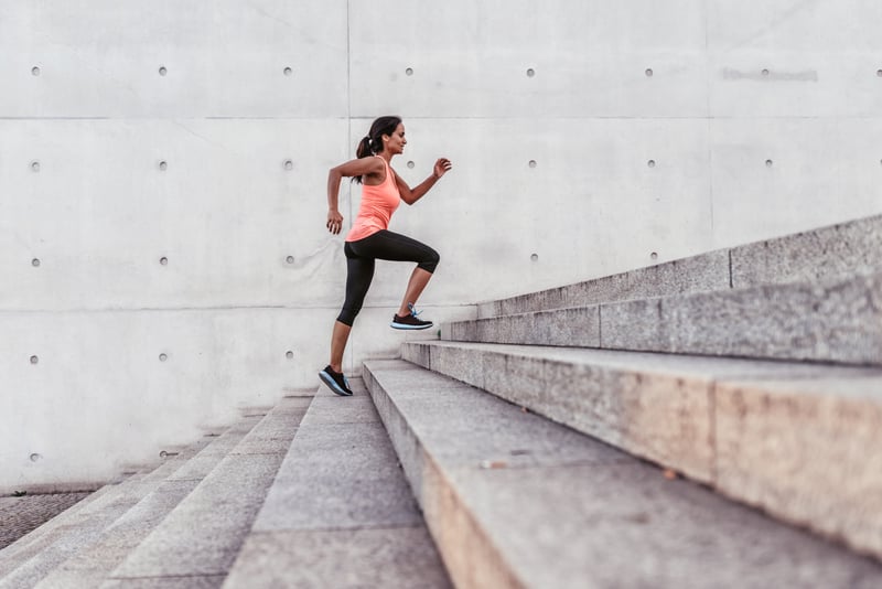 woman running up stairs