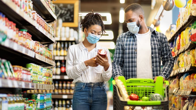 young couple shops in super market